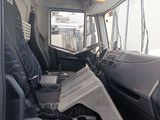 a picture of the inside of a truck with the driver ' s seat up