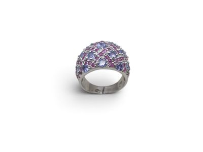 a close up of a ring on a white surface