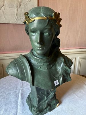 statue of a woman with a crown on her head on a table