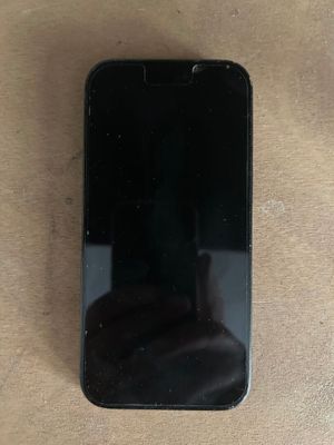 a close up of a cell phone sitting on a table