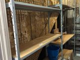 many shelves that are in a room with boxes on them