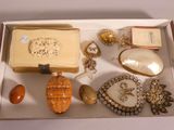 a box filled with assorted jewelry on a table