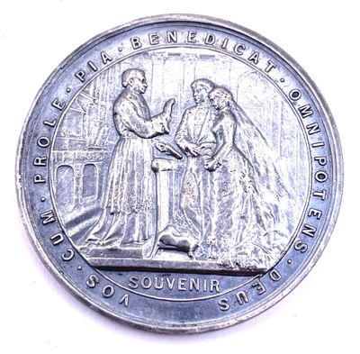une image représentant une pièce de monnaie sur laquelle figurent un homme et une femme se serrant la main