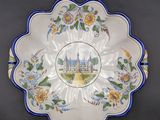a decorative plate with a picture of a castle on it