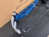 the bow is laying on the ground next to the box