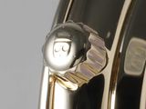 a close up view of a watch with a silver dial