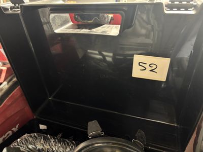a black stove with a metal pan inside of it