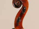 an old violin with a wooden back and a long neck