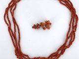 an image of a necklace and earring set with coral beads