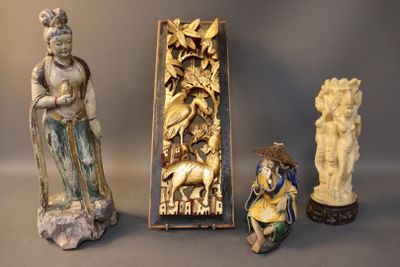 three statues of asian women and a statue of a man