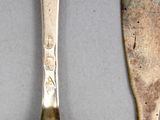 two spoons and a spoon on a table