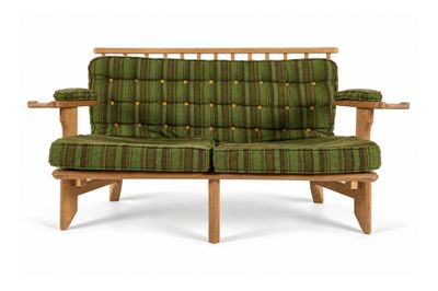 green and brown striped loveseat with wooden arms and arms