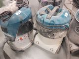 two vacuums that are sitting on top of a table