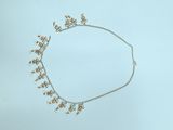 gold plated necklace with flowers and leaves on a silver chain