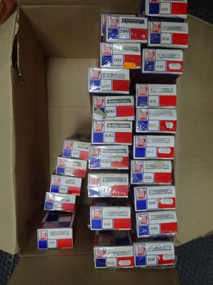 a cardboard box with many different types of cigarettes in it