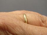 a close up of a person ' s hand with a ring on it