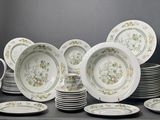 a lot of plates and cups on a table