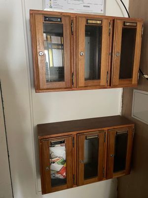 a kitchen with a refrigerator and a microwave in it