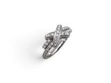 a close up of a diamond ring on a white background