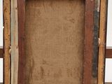 an old wooden picture frame with a piece of fabric in the middle of it
