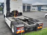 a semi truck that is parked in a parking lot
