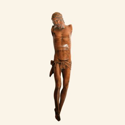 an image of a wooden statue of a man on a cross