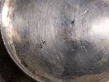 a metal pan with a handle on a stove