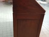 a small wooden podium in the middle of a room