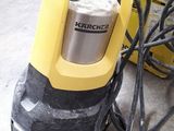 a yellow machine that is sitting on the floor