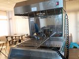 an image of a commercial kitchen with stainless steel appliances