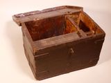 an old wooden box with a lid on a white surface