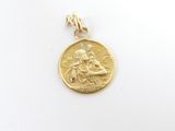 a close up of a gold coin with a woman on it