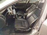 the interior of a car with black leather seats and a steering wheel