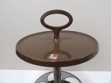 a brown stool with a glass top on a white table