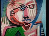 tableau représentant un homme à lunettes et barbu, vêtu d'une chemise verte