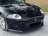 a black sports car parked on the side of the road