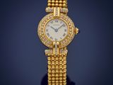 a lady ' s gold and diamond wrist watch