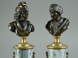 pair of bronze and marble busts of a man and a woman