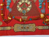 a picture of a red cloth with a design on it