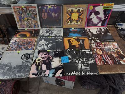 a lot of records on a table in a room