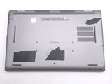 a silver laptop with a broken battery cover on it