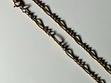 a chain that has been placed on a white surface