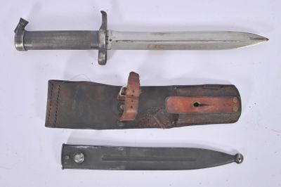 three different types of knives on a white surface