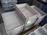 many crates stacked on top of each other in a warehouse