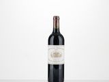 a bottle of red wine sitting on top of a table