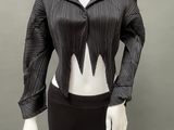 the mannequin is wearing a black top and black pants