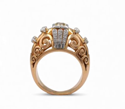 a close up of a gold ring with diamonds on a white background