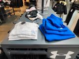 a table with a bunch of clothing on it