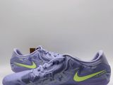 a pair of purple and yellow soccer shoes on a white background