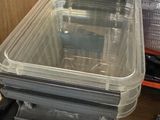a plastic container sitting on top of a wooden table